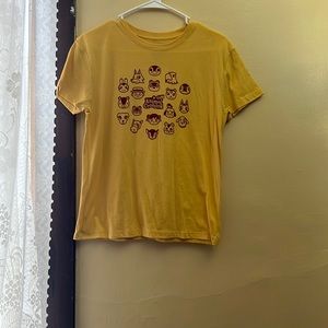 I am selling a yellow animal crossing shirt.